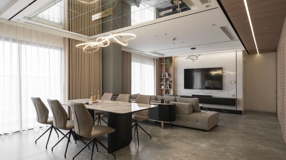 Dining in warm luxury - bàn marble veined, ghế taupe và orbit chandelier tạo điểm nhấn tinh tế