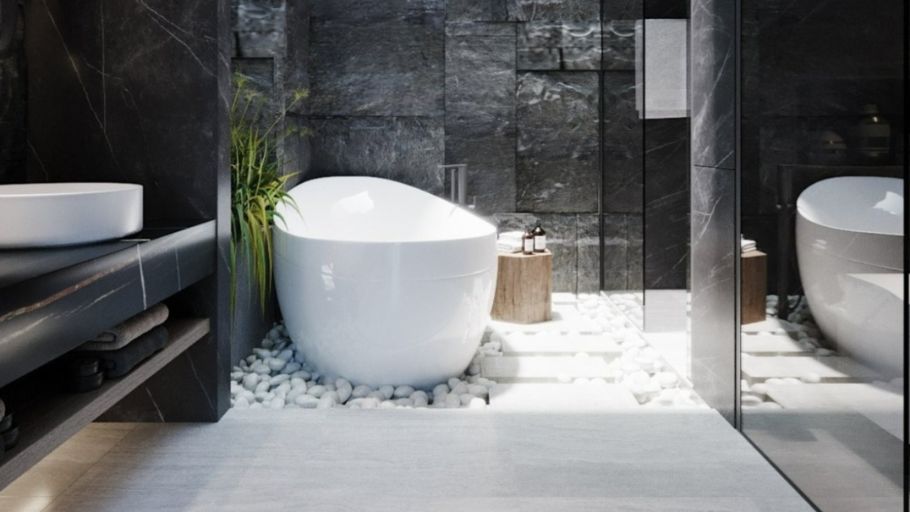 Phòng tắm Master mang đến trải nghiệm thụ hưởng tựa resort 5 sao với bồn tắm độc lập đặt trên lớp sỏi trắng, nổi bật trên nền vách đá tự nhiên thô mộc đầy chiều sâu