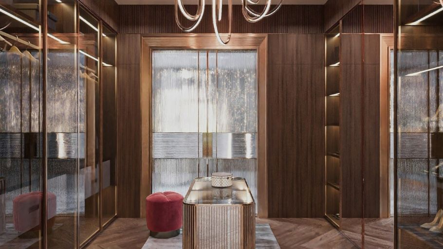 Phòng thay đồ (walk-in closet) phô diễn sự xa hoa tựa như một boutique hàng hiệu với hệ tủ vách kính kết hợp ánh sáng phân lớp tôn lên vẻ đẹp của vật liệu