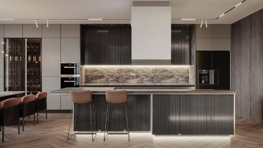 Khu vực bếp đương đại toát lên vẻ đẹp đầm chắc nhờ sự kết hợp tinh tế giữa hệ tủ ốp vách nan gỗ (fluted wood), mặt đá nguyên khối và sàn lát xương cá kinh điển