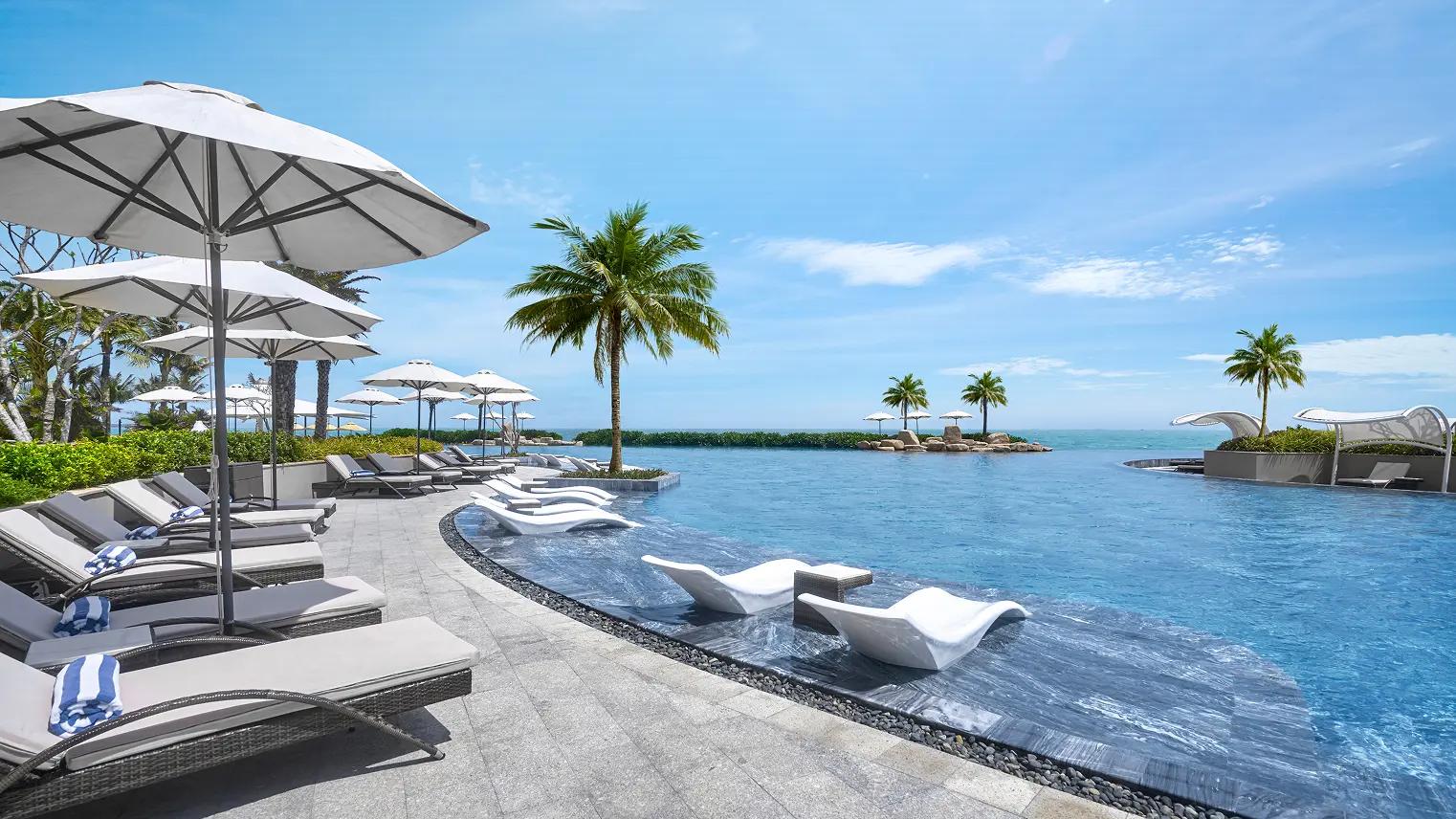 A beach villa with an open design, harnessing natural light and optimizing the private resort experience