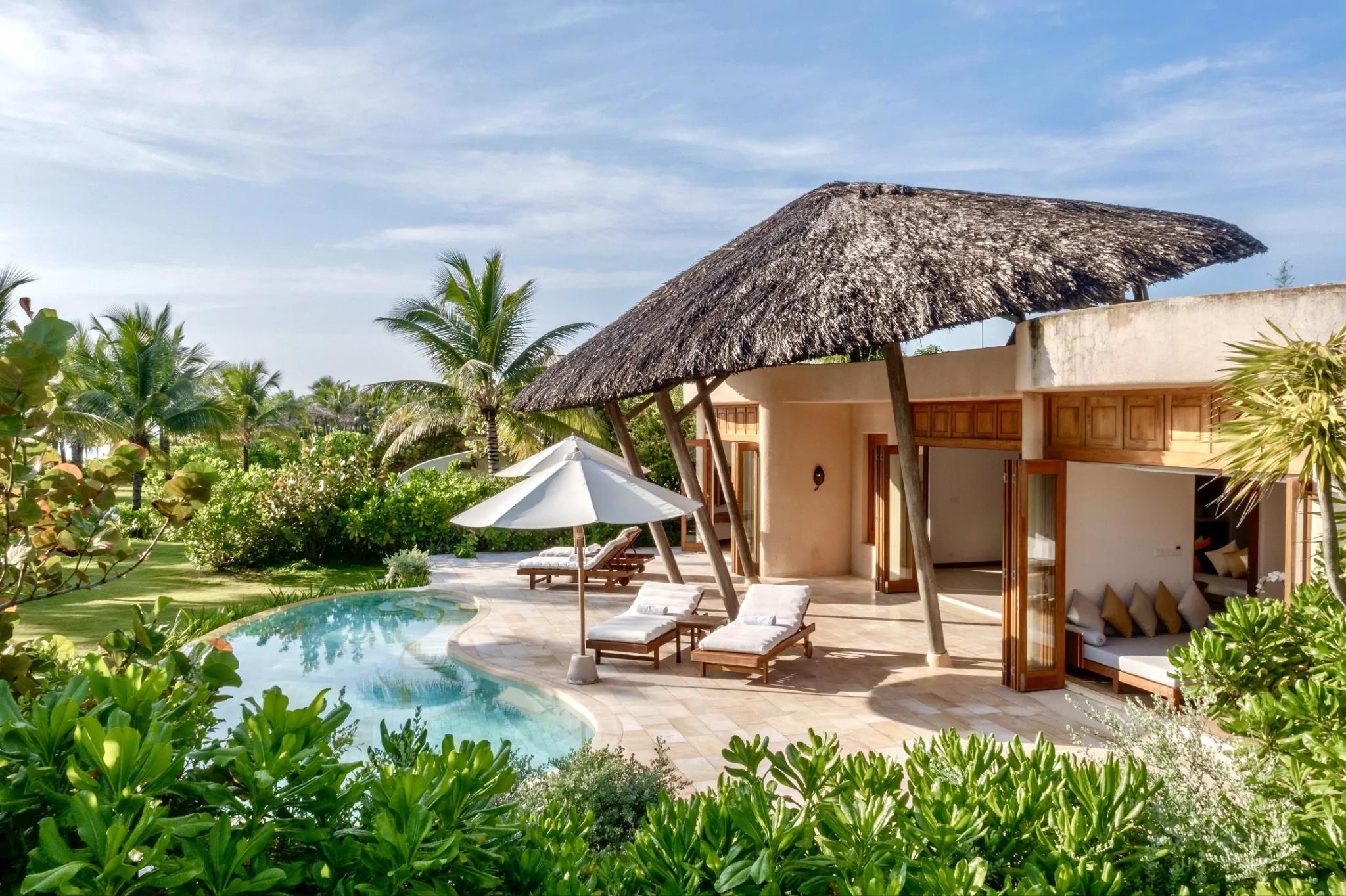The Minimalism-style beachfront villa stands out with a streamlined design, balancing light and natural materials