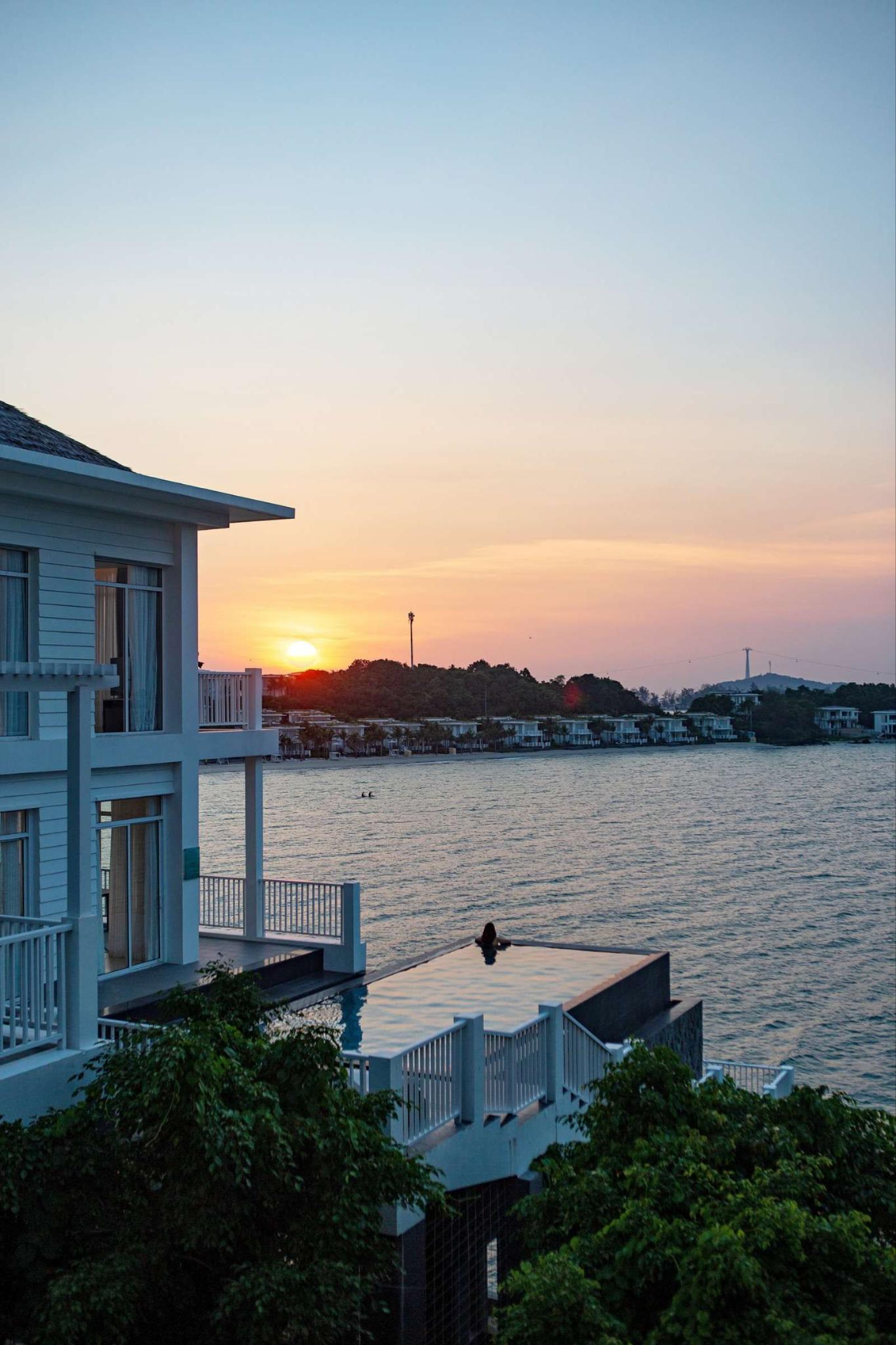 A private pool in the Phu Quoc resort villa creates a relaxing focal point amid a luxurious living space