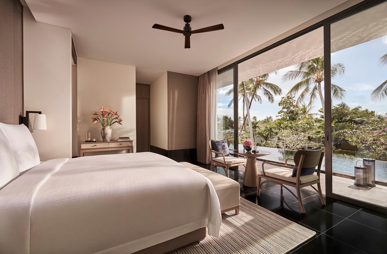 The villa bedroom space with an open design, connecting directly with the outside landscape