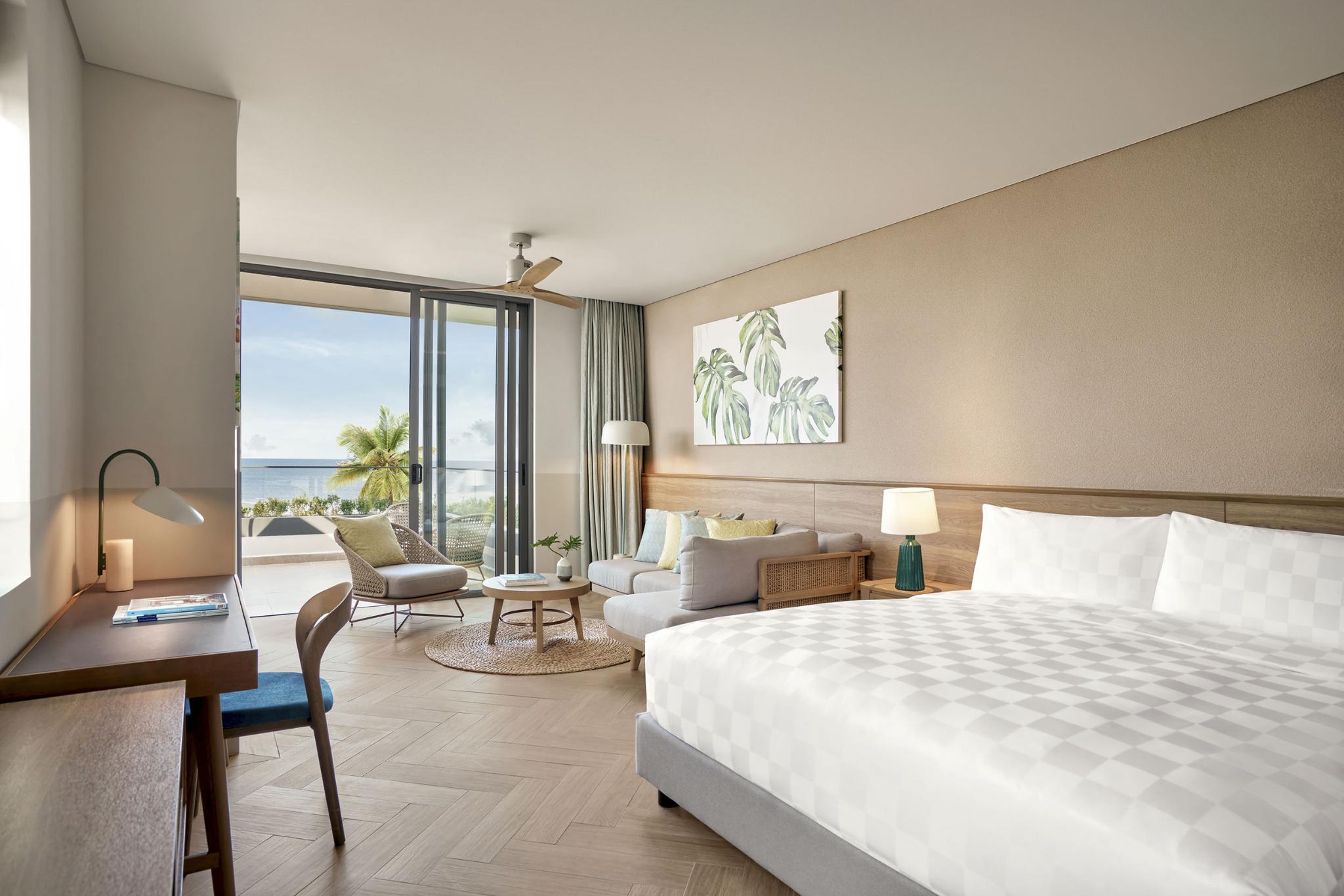 A private resort bedroom space with an ocean-facing view and a refined design, delivering a complete relaxation experience