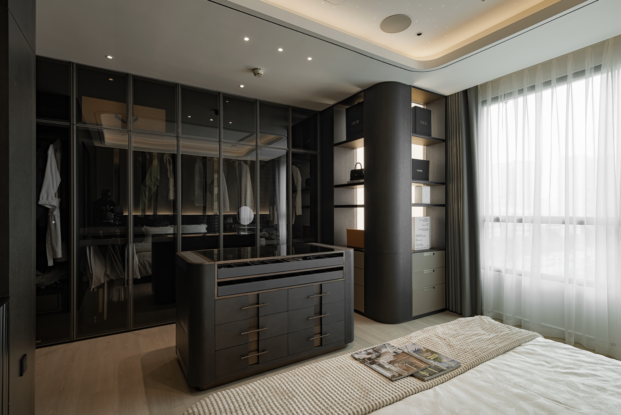 A premium dressing room – Glass cabinetry combined with LED lighting creates a comfortable, aesthetic storage space.