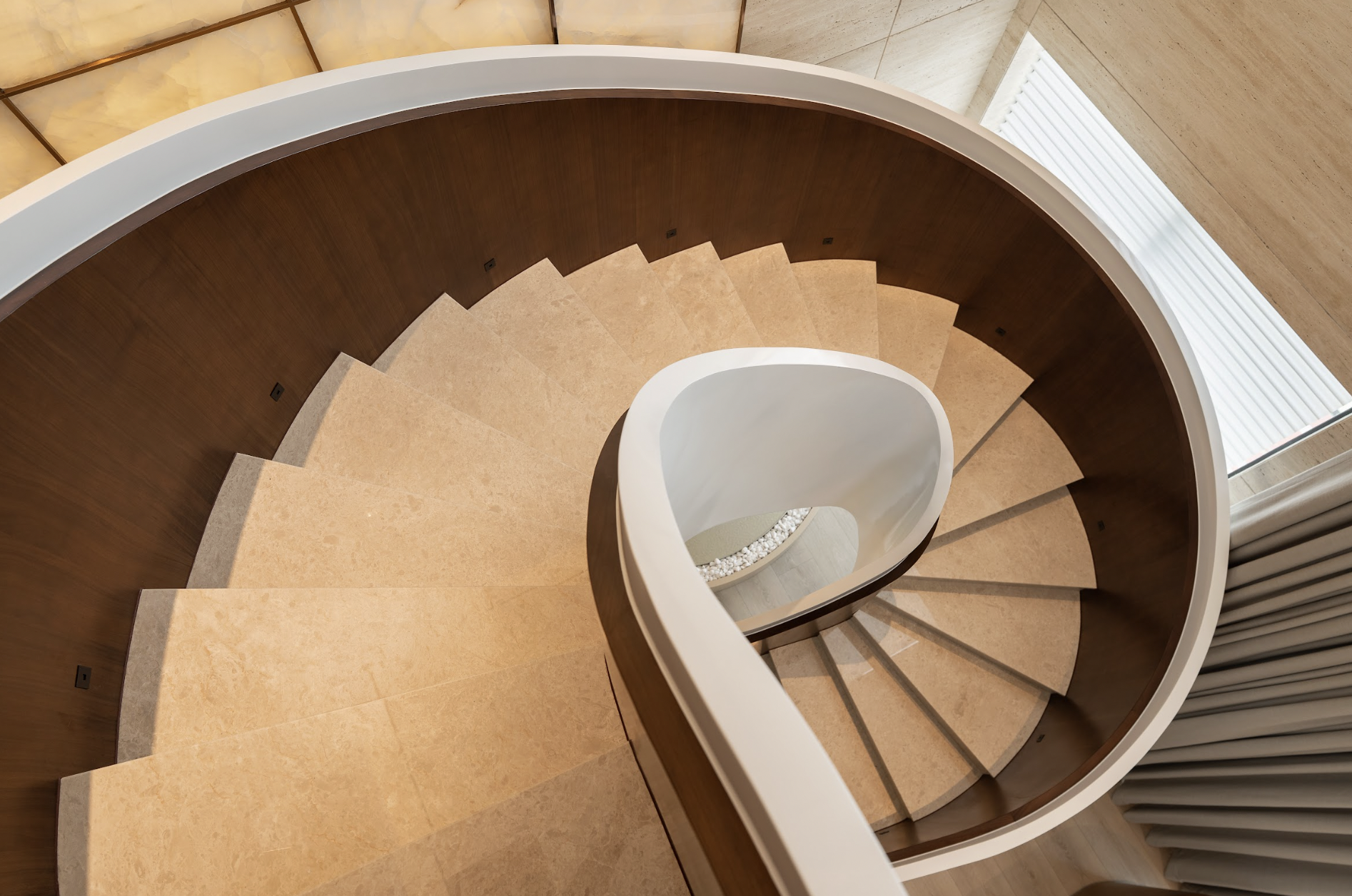 The staircase in the Lan Anh Village villa is designed as an architectural focal point in the overall interior, harmoniously combining premium materials, light, and streamlined lines.