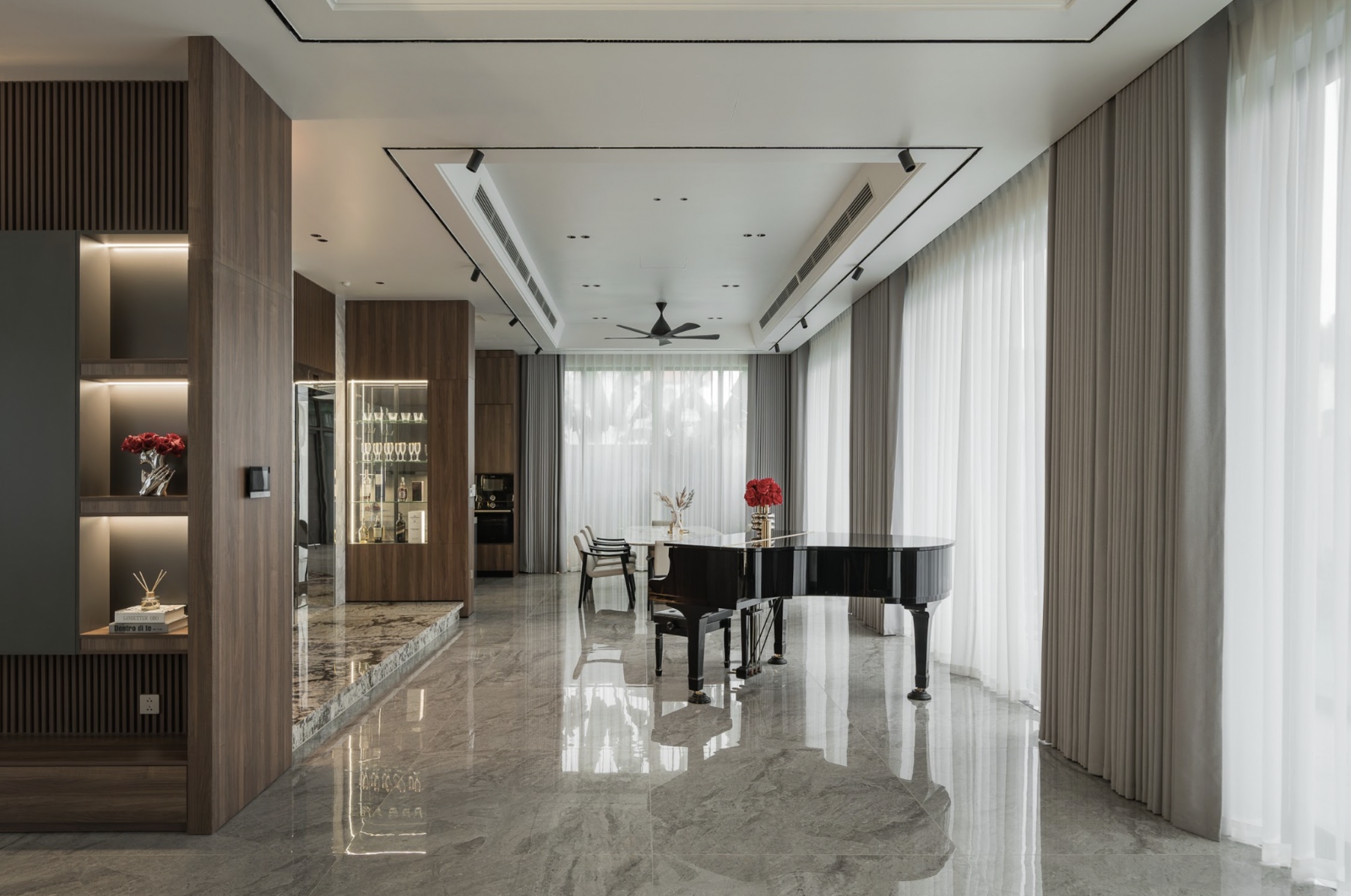 The open Hung Thai District 7 villa space balances modern comfort, natural light, and a connection with the garden.