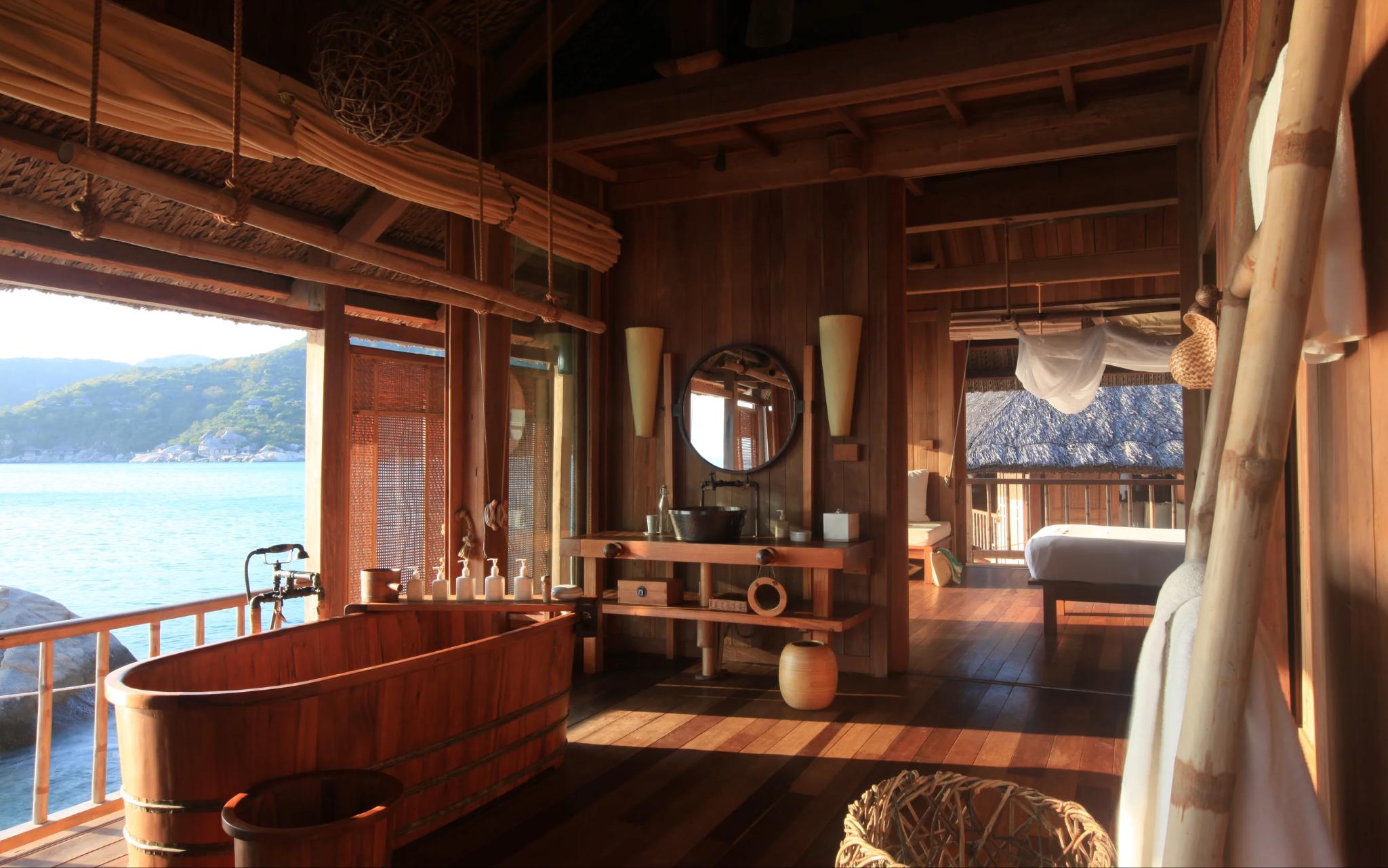 The resort villa bathroom design using natural materials, creating a relaxing feel amid a green space